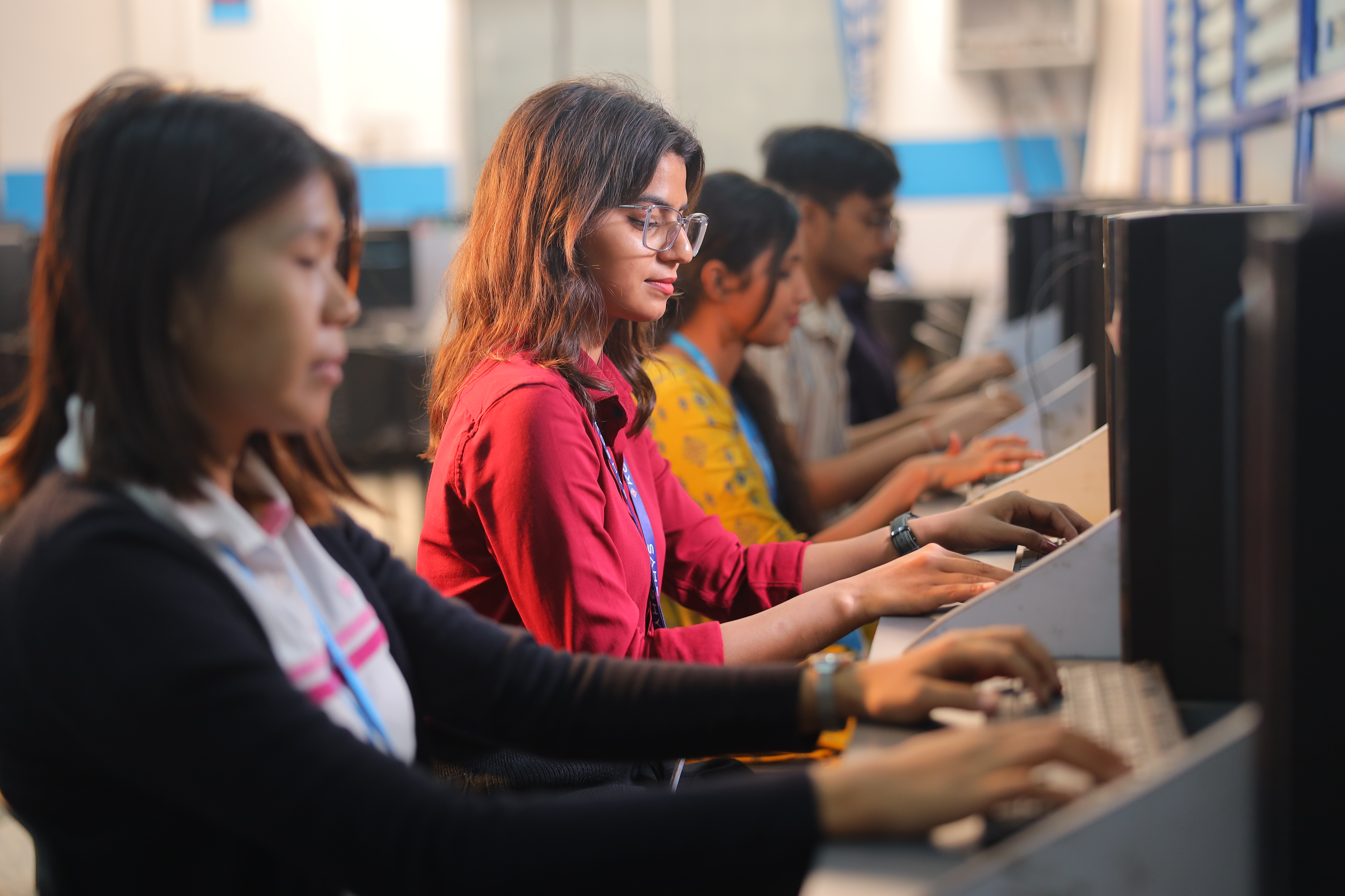 Students working at computer workstations in a lab